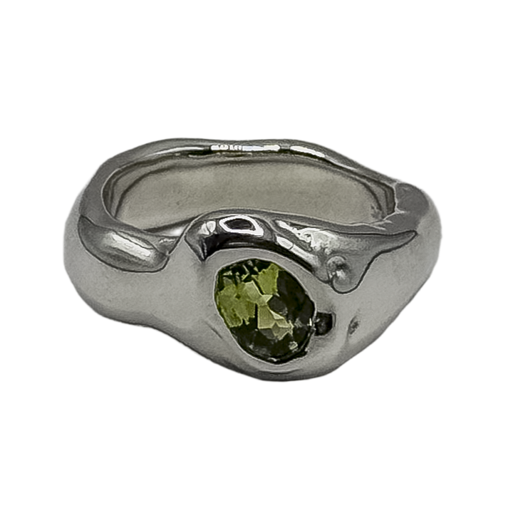 Silver ring with a green gemstone on a white background