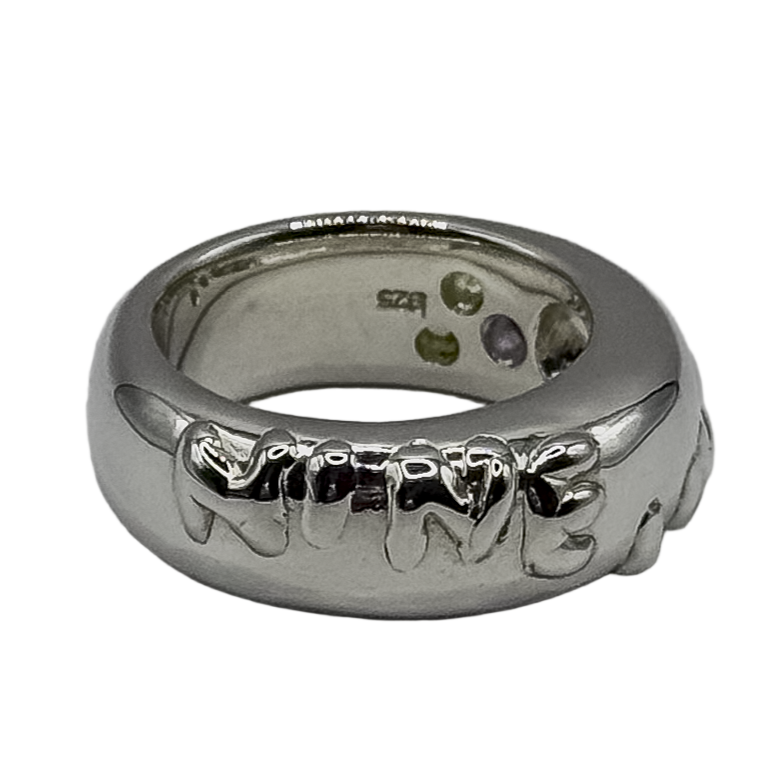 silver ring with "nine lives" raised detail